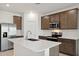 Modern kitchen with stainless steel appliances and an island at 25380 W Sunland Ave, Buckeye, AZ 85326