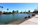 Concrete walkway along a lake with rock border at 2563 W Jacinto Cir, Mesa, AZ 85202