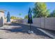 Small backyard with gravel and two patio umbrellas at 2743 N Lema Dr, Mesa, AZ 85215