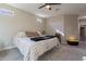 King-size bed in a well-lit bedroom with a ceiling fan at 2743 N Lema Dr, Mesa, AZ 85215