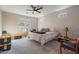 Bright bedroom featuring a cozy bed and ceiling fan at 2743 N Lema Dr, Mesa, AZ 85215