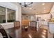 Bright dining room with dark wood table and kitchen view at 2743 N Lema Dr, Mesa, AZ 85215