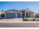 Modern single story home with gray exterior and two-car garage at 2743 N Lema Dr, Mesa, AZ 85215