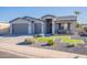 Single-story home with gray exterior, two-car garage, and landscaped front yard at 2743 N Lema Dr, Mesa, AZ 85215