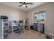Spacious home office with standing desk, ample natural light, and backyard view at 2743 N Lema Dr, Mesa, AZ 85215
