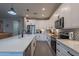 Modern kitchen with white cabinets, quartz countertops, and stainless steel appliances at 2743 N Lema Dr, Mesa, AZ 85215