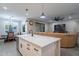 Modern kitchen with white cabinets, island, and stainless steel appliances at 2743 N Lema Dr, Mesa, AZ 85215