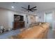 Living room with brown leather sectional and a large flat screen TV at 2743 N Lema Dr, Mesa, AZ 85215