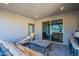 Covered patio with comfortable seating area and access to backyard at 2743 N Lema Dr, Mesa, AZ 85215