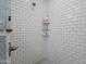 Spacious shower with subway tile and corner shelving at 2743 N Lema Dr, Mesa, AZ 85215