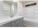Bathroom features gray vanity, a large tub, and tile flooring at 430 S 81St Pl, Mesa, AZ 85208