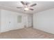 Bright bedroom with ceiling fan and neutral carpet at 430 S 81St Pl, Mesa, AZ 85208