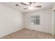 Bedroom with ceiling fan and neutral carpet at 430 S 81St Pl, Mesa, AZ 85208
