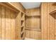 Large walk-in closet with wood paneling and shelving at 430 S 81St Pl, Mesa, AZ 85208