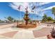Fountain in the community with flag poles and landscaping at 430 S 81St Pl, Mesa, AZ 85208