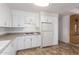 White kitchen features gas cooktop and ample cabinet space at 430 S 81St Pl, Mesa, AZ 85208