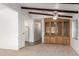 Living room with built-in hutch and access to kitchen at 430 S 81St Pl, Mesa, AZ 85208