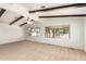 Spacious living room with wood beam ceilings at 430 S 81St Pl, Mesa, AZ 85208