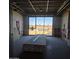 Large interior room under construction with large window and mountain views at 6587 N Palmeraie Blvd # 2017, Paradise Valley, AZ 85253