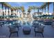 Relaxing resort-style pool with lounge chairs and palms at 6587 N Palmeraie Blvd # 2017, Paradise Valley, AZ 85253