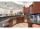 Home bar with granite countertop and extensive cabinetry at 9968 W Jj Ranch Rd, Peoria, AZ 85383