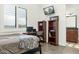 Cozy bedroom with built-in shelving, desk area, and ensuite bathroom at 9968 W Jj Ranch Rd, Peoria, AZ 85383