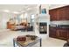 Large bedroom with a king-size bed and adjacent wet bar at 9968 W Jj Ranch Rd, Peoria, AZ 85383