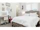 Bright bedroom with a vanity area and comfortable queen bed at 9968 W Jj Ranch Rd, Peoria, AZ 85383