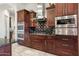 Gourmet kitchen with double ovens, stainless steel appliances, and granite countertops at 9968 W Jj Ranch Rd, Peoria, AZ 85383