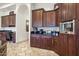 Kitchen boasts ample cabinetry, breakfast bar, and built-in coffee station at 9968 W Jj Ranch Rd, Peoria, AZ 85383