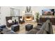Elegant living room with a cozy fireplace and comfortable leather seating at 9968 W Jj Ranch Rd, Peoria, AZ 85383