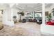 Relaxing living room with large windows overlooking the backyard oasis at 9968 W Jj Ranch Rd, Peoria, AZ 85383