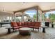 Spacious covered patio with comfortable seating and outdoor fireplace at 9968 W Jj Ranch Rd, Peoria, AZ 85383
