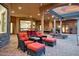 Covered patio with comfortable seating and pool views at 9968 W Jj Ranch Rd, Peoria, AZ 85383