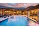 Inviting pool area with expansive patio and luxurious lounge seating at 9968 W Jj Ranch Rd, Peoria, AZ 85383
