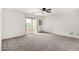 Bedroom with sliding door to balcony at 104 W Red Mesa Trl, San Tan Valley, AZ 85143