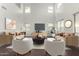 Living room with staged furniture and high ceilings at 104 W Red Mesa Trl, San Tan Valley, AZ 85143