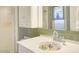 Bathroom features a pedestal sink and green tile at 10533 W Wheatridge Dr, Sun City, AZ 85373
