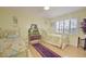 Guest bedroom with twin beds and wood flooring at 10533 W Wheatridge Dr, Sun City, AZ 85373