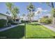 Landscaped community courtyard with walkways and lush green grass at 10533 W Wheatridge Dr, Sun City, AZ 85373