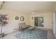 Cozy covered patio with neutral tones, stylish furniture, and a ceiling fan at 10533 W Wheatridge Dr, Sun City, AZ 85373