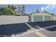 Property exterior features a two car garage and gated entryway at 10533 W Wheatridge Dr, Sun City, AZ 85373