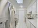 Modern kitchen with stainless steel appliances, white cabinets, and stylish tile backsplash at 10533 W Wheatridge Dr, Sun City, AZ 85373