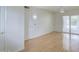 Spacious living room with sliding glass doors and a ceiling fan for added comfort at 10533 W Wheatridge Dr, Sun City, AZ 85373