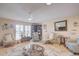 Spacious living room featuring comfortable seating and a large wood coffee table at 10533 W Wheatridge Dr, Sun City, AZ 85373