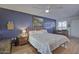 Spacious main bedroom with hardwood floors and ceiling fan at 10533 W Wheatridge Dr, Sun City, AZ 85373