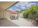 Charming outdoor patio with an umbrella and colorful plants for a relaxing ambiance at 10533 W Wheatridge Dr, Sun City, AZ 85373