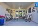 Relaxing covered patio with seating and a view of the garden at 10533 W Wheatridge Dr, Sun City, AZ 85373