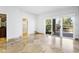 Spacious bedroom with tile floors and sliding glass doors to patio at 10796 N 78Th St, Scottsdale, AZ 85260