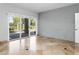 Bright bedroom with tile floors, brick accent wall, and patio access at 10796 N 78Th St, Scottsdale, AZ 85260